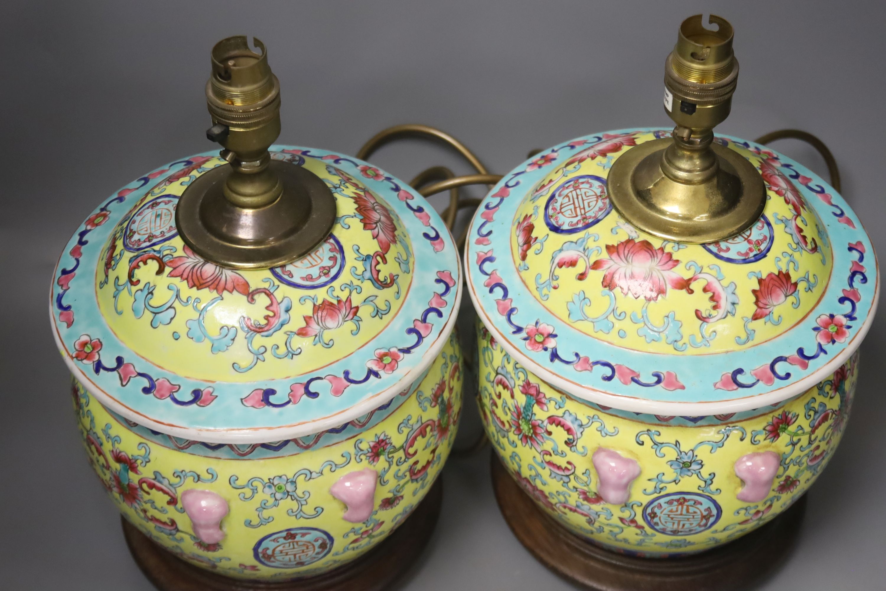 A pair of Chinese yellow ground porcelain table lamps, height 25cm excl. light fittings